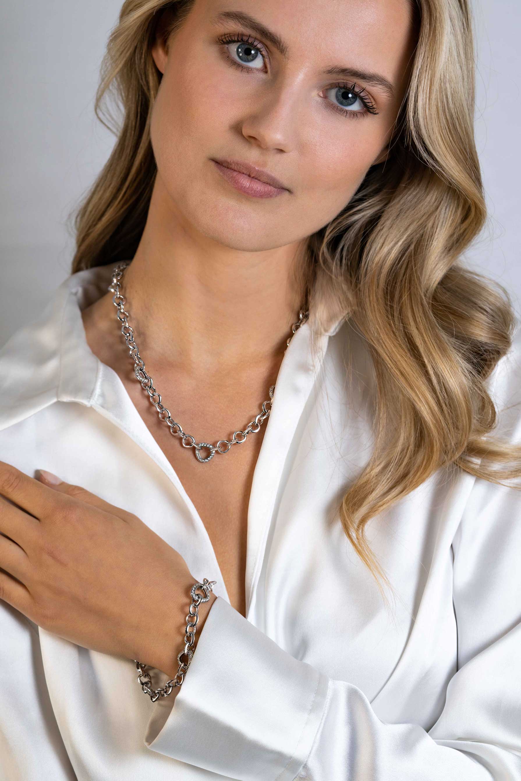 ZINZI zlv. armband met schakels driehoek zirc.
