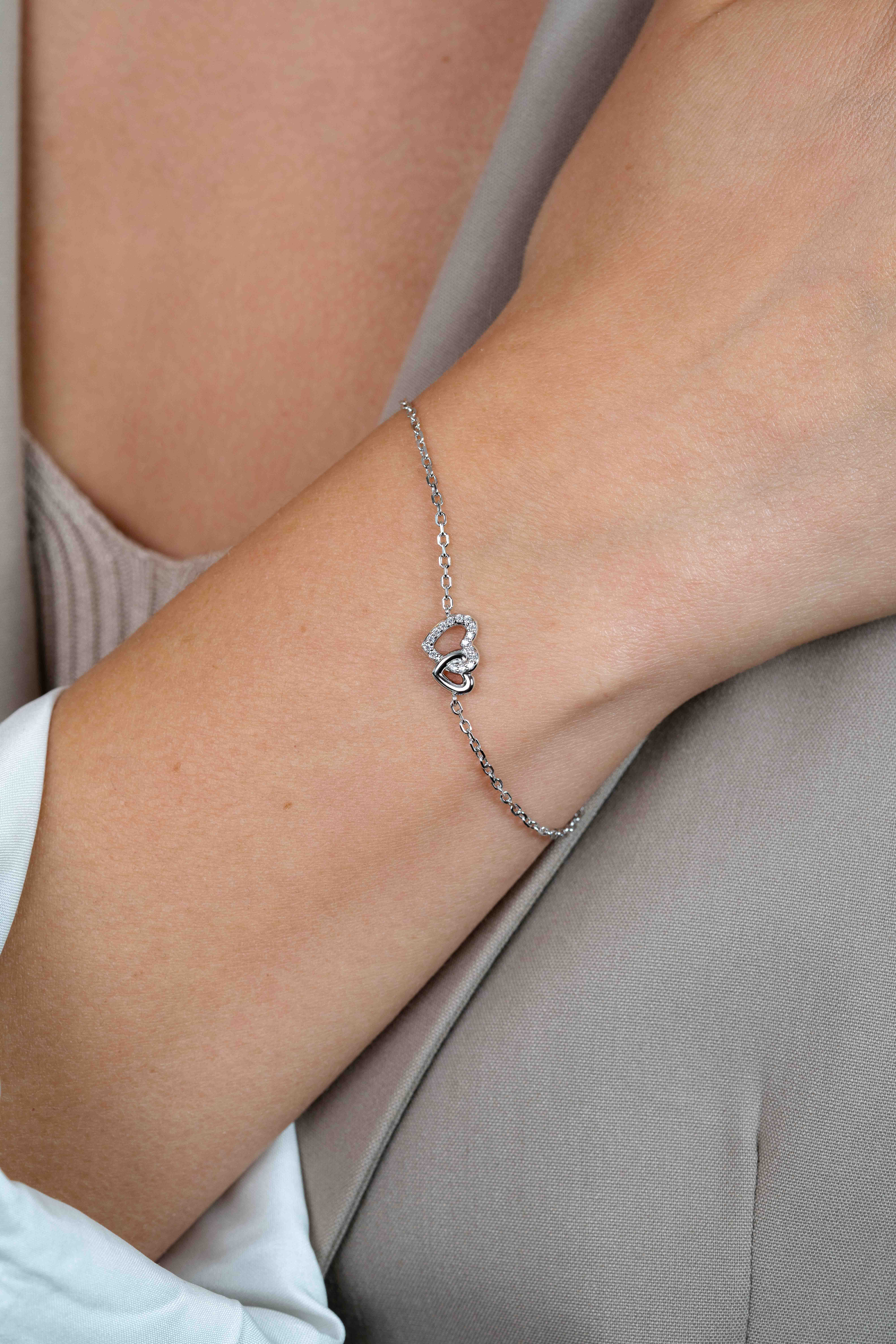 ZINZI zlv. armband 2 hartjes verbonden 1x zirc.