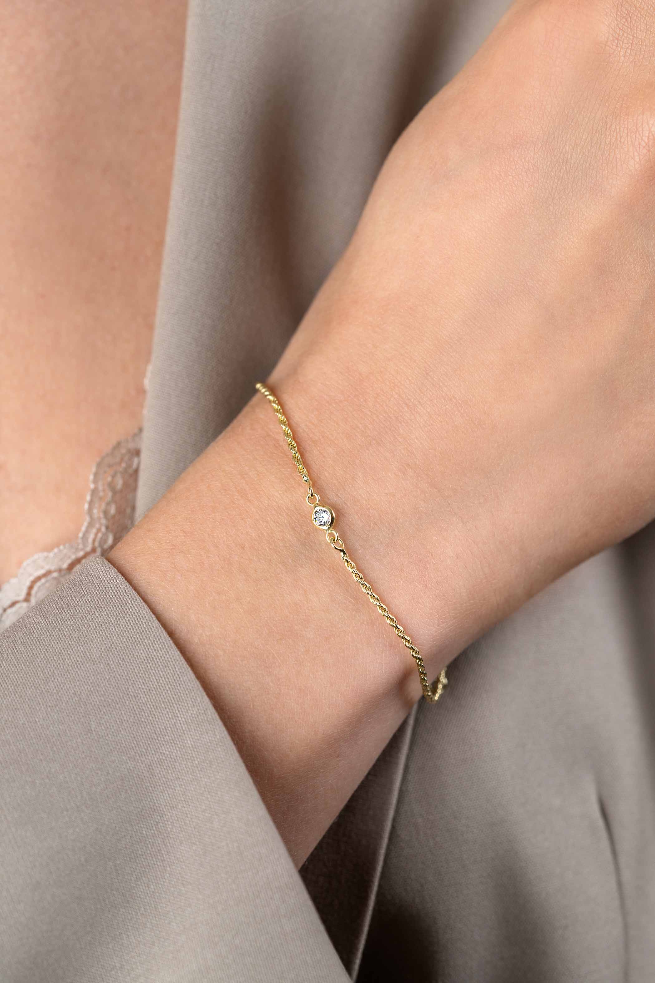 ZINZI zlv. armband gg.verg. koord met zirconia