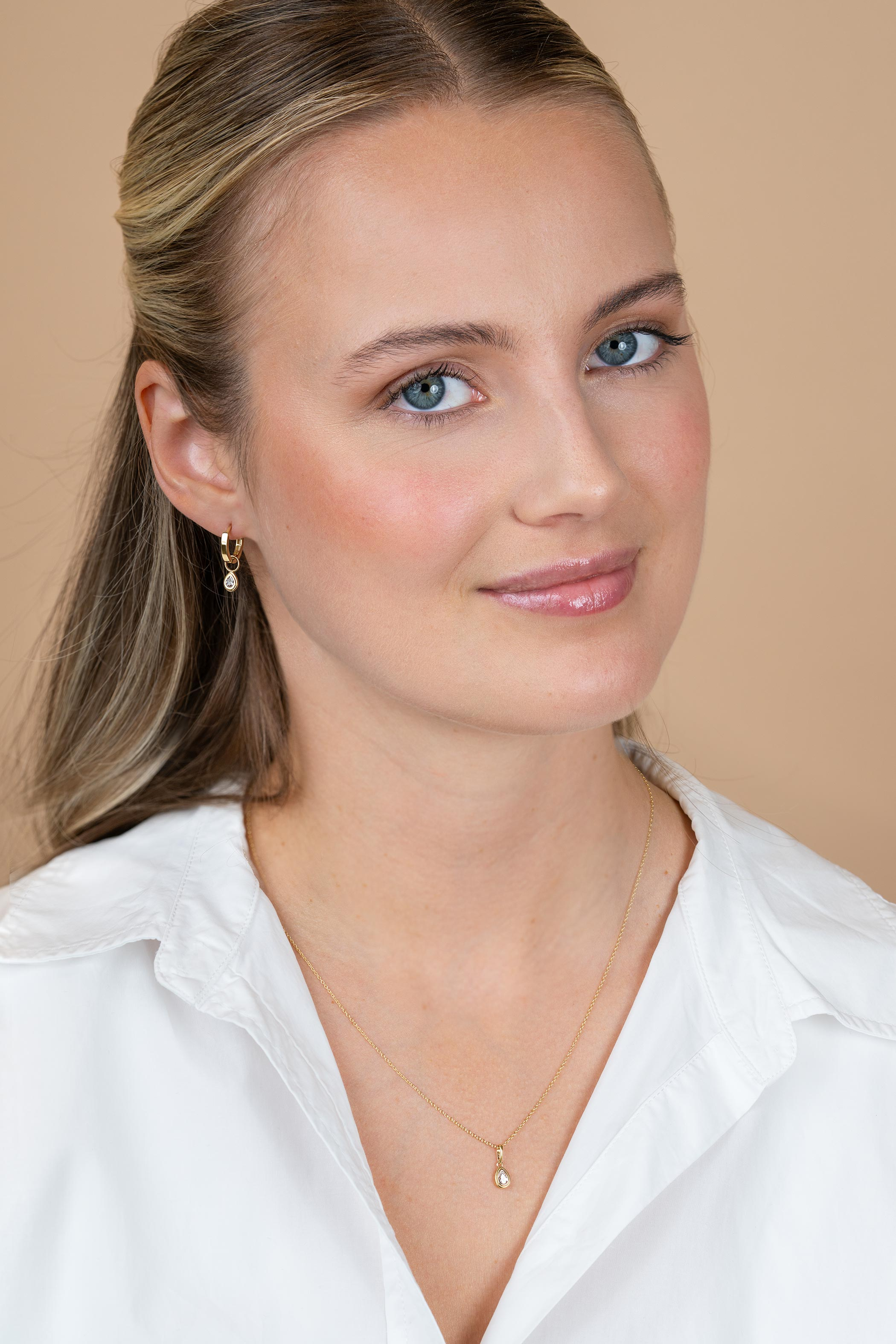 ZINZI GOLD oorbedels peervormig met zirconia