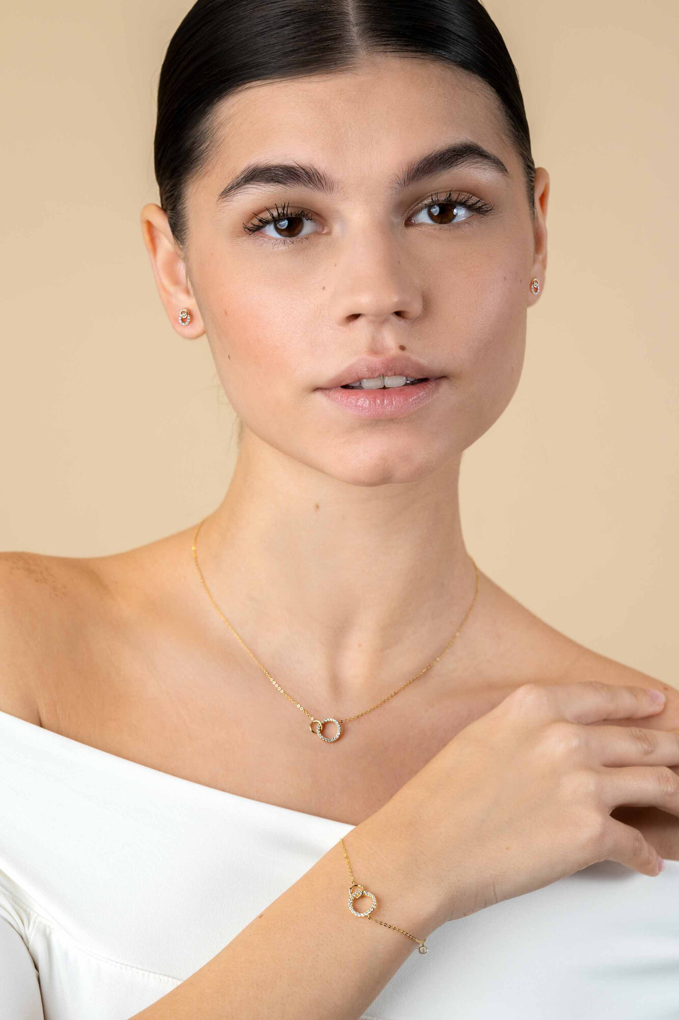 ZINZI GOLD oorknopjes 2 rond elkaar 1 met zirc.