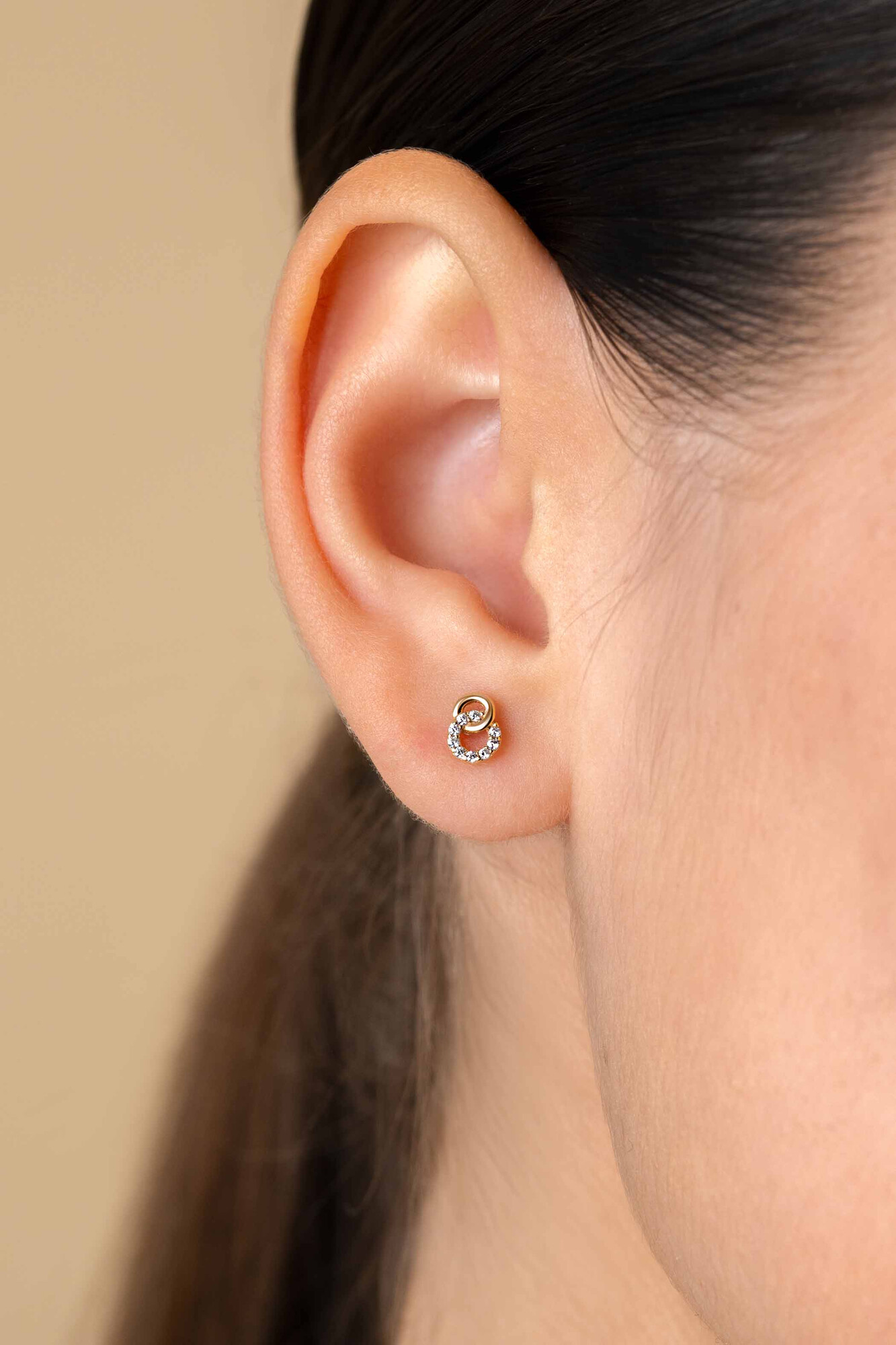 ZINZI GOLD oorknopjes 2 rond elkaar 1 met zirc.