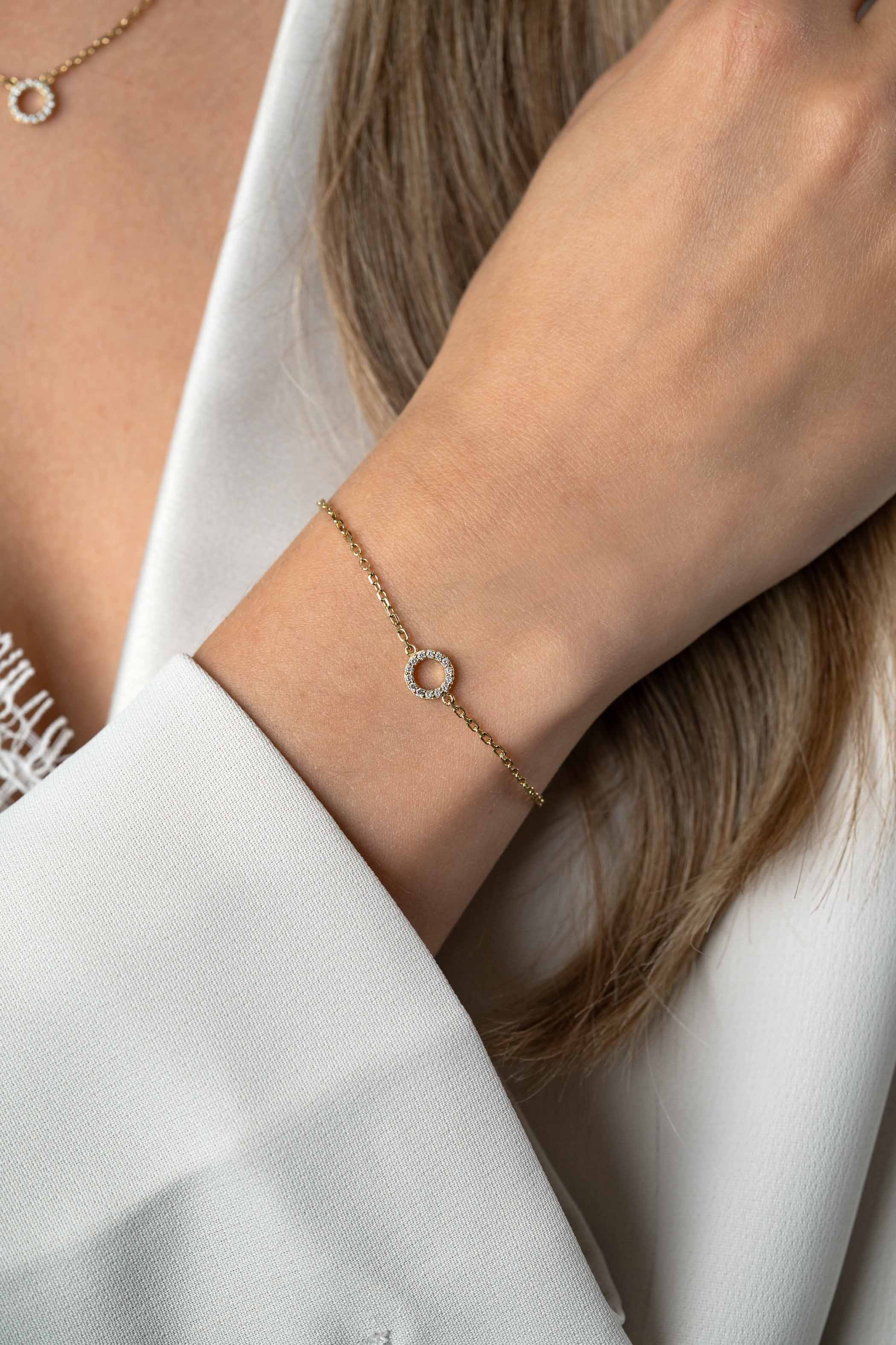 ZINZI zlv. armband gg.verg. open rondje bezet zirc.