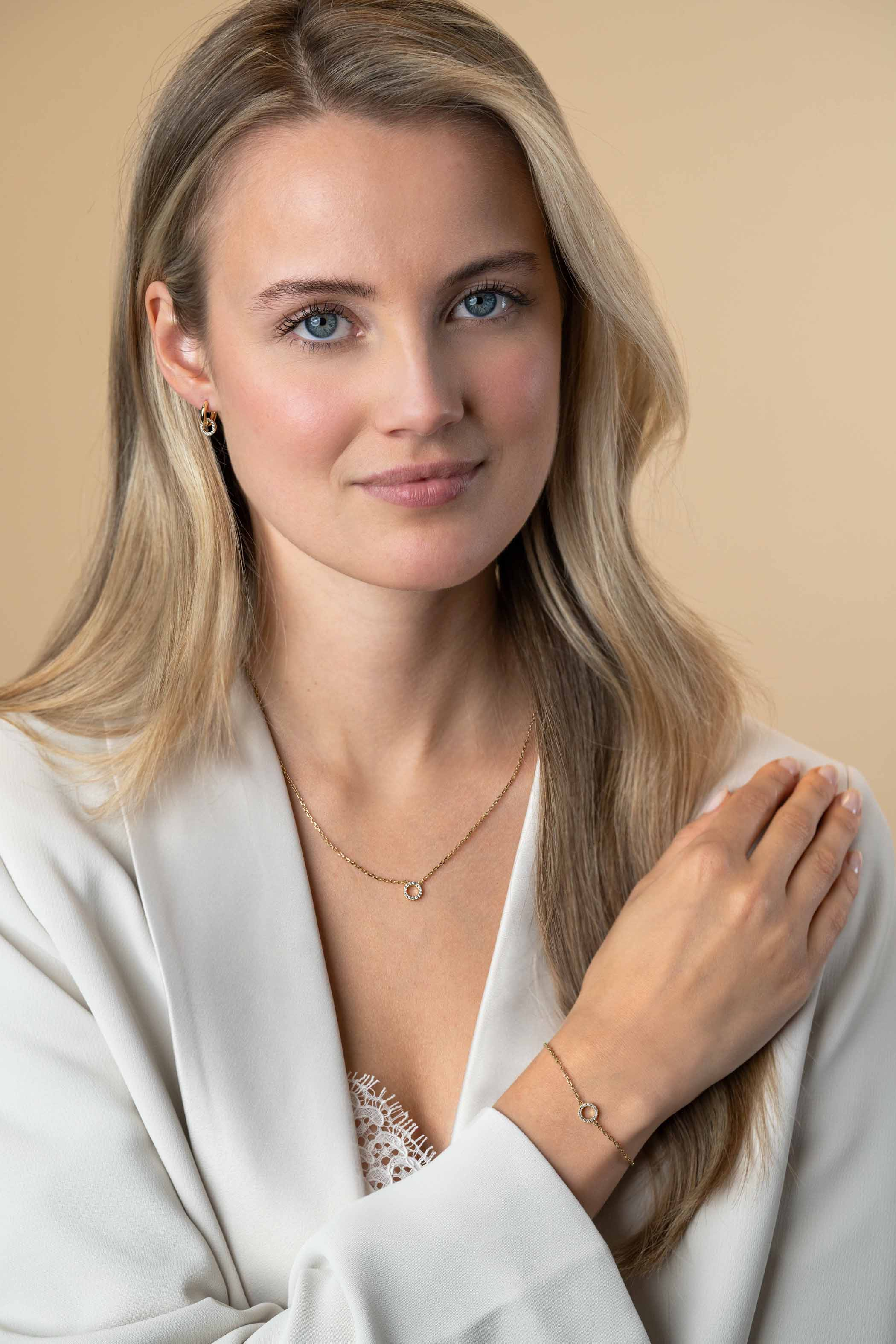 ZINZI zlv. armband gg.verg. open rondje bezet zirc.