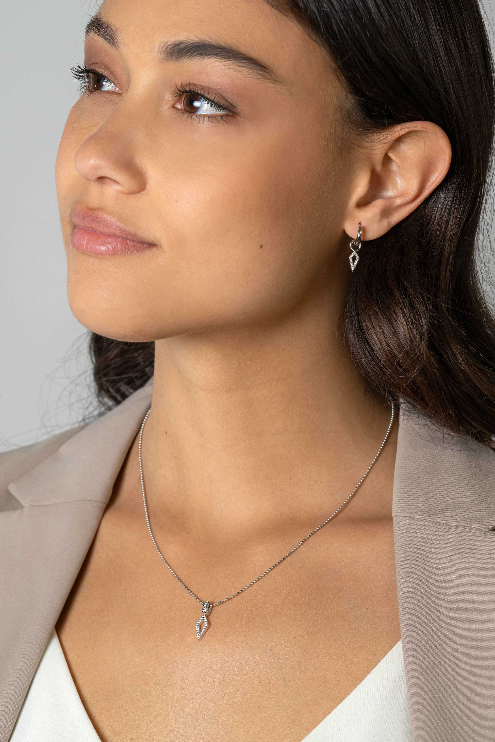 ZINZI zlv. oorbedels vliegervorm open met zirconia's