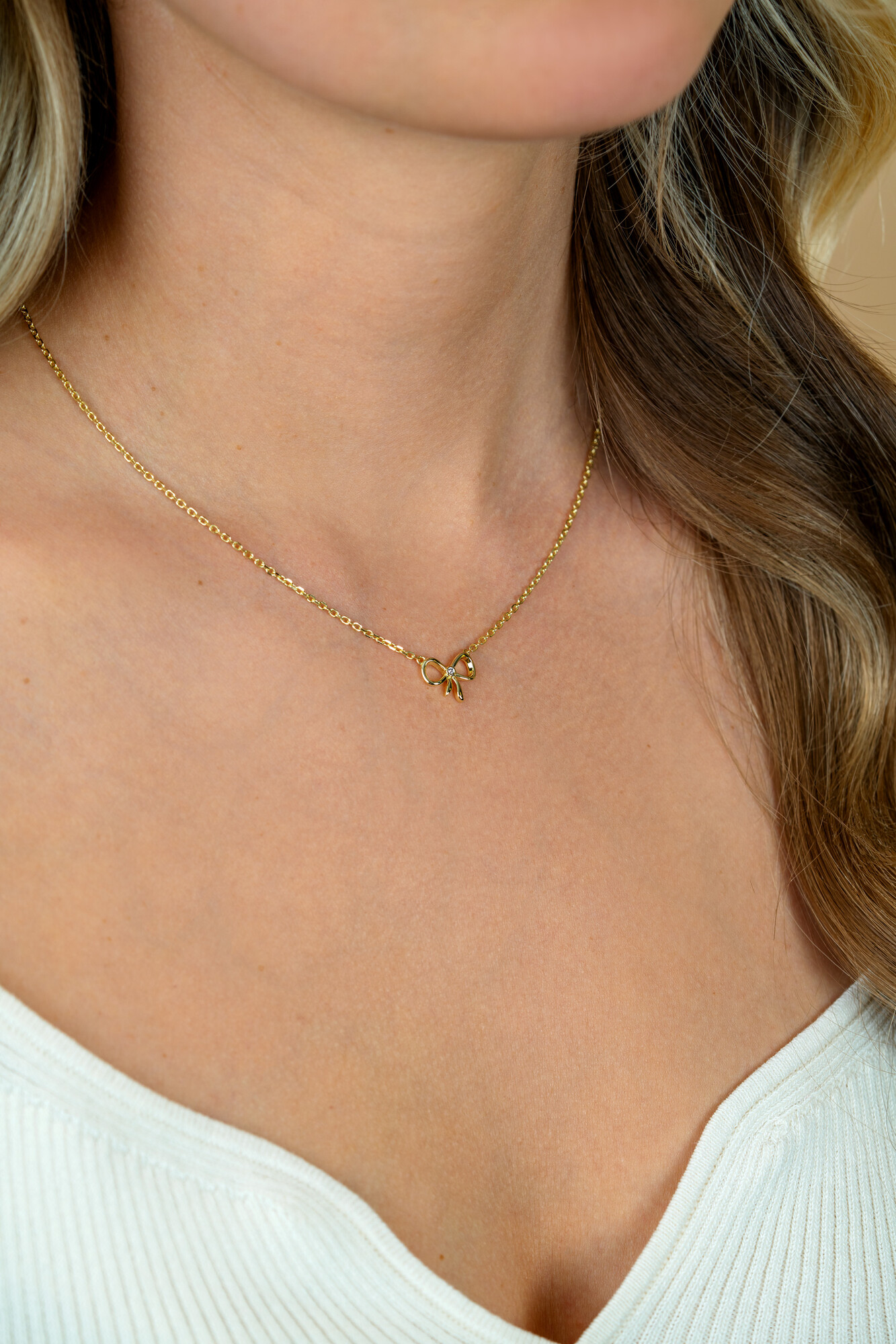 ZINZI zlv. collier geel verguld met strikje en zirconia