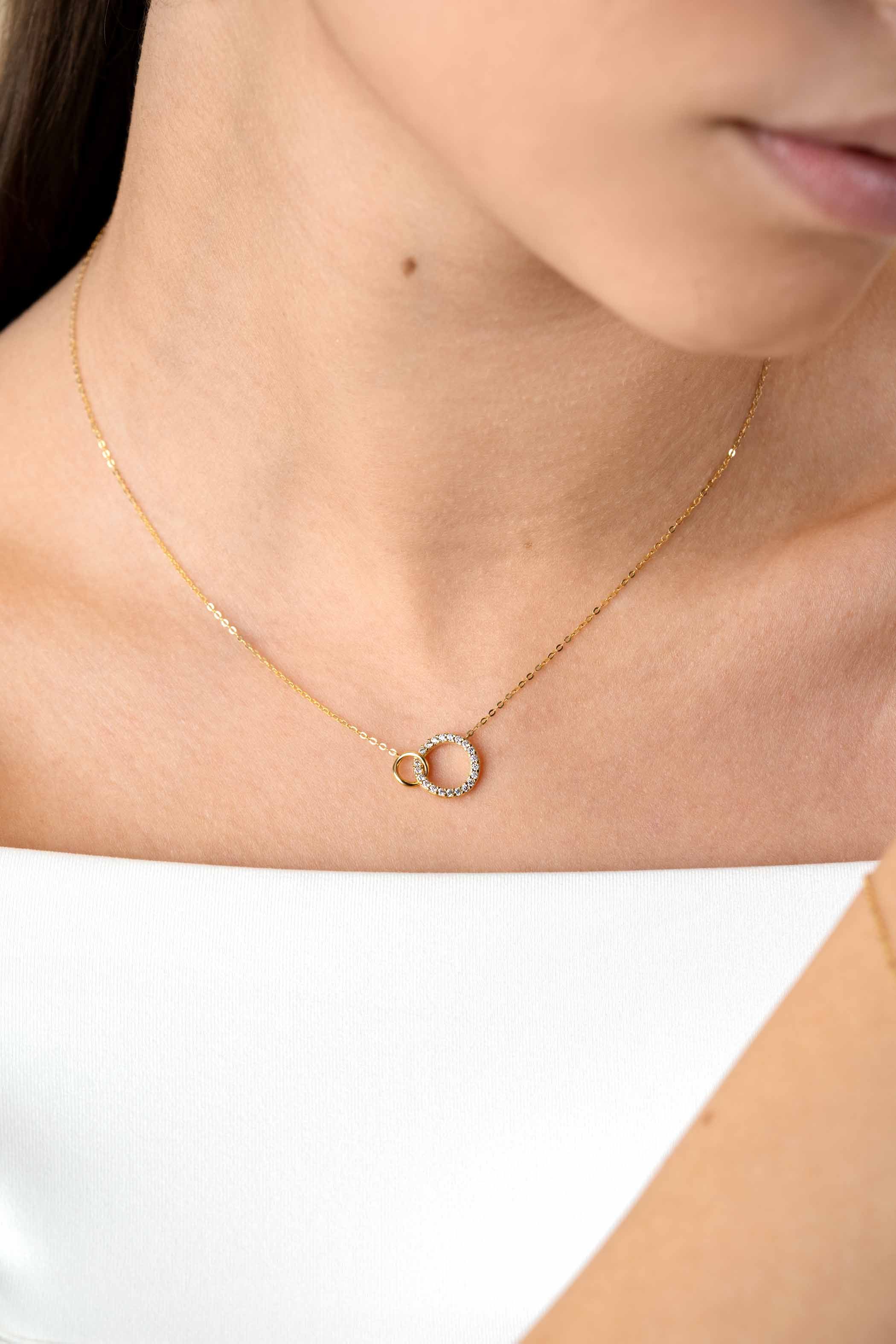 ZINZI GOLD coll. 2 ronde vormen in elkaar 1x zirc.