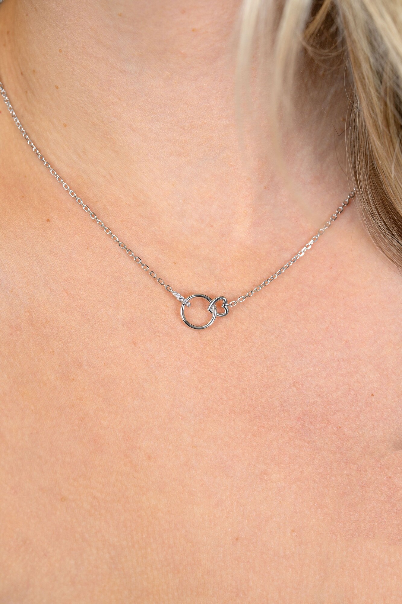 ZINZI zlv. collier verbonden rond/hart/oog met zirc.