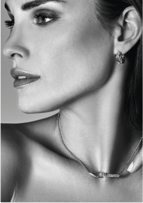 "Mart Visser by ZINZI Silberne Luxusohrringe 18x8mm geknotete Form, besetzt mit weißen Zirkonias MVO19"